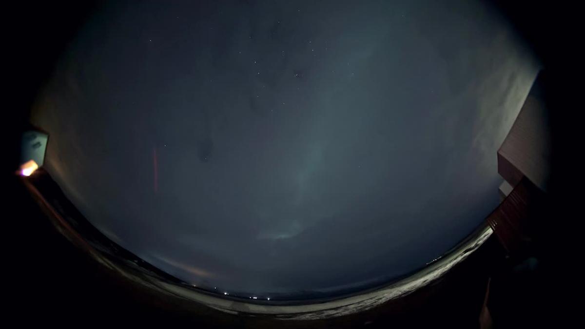 Spooky Northern Lights appear from behind clouds in Iceland in stunning 4K time-lapse